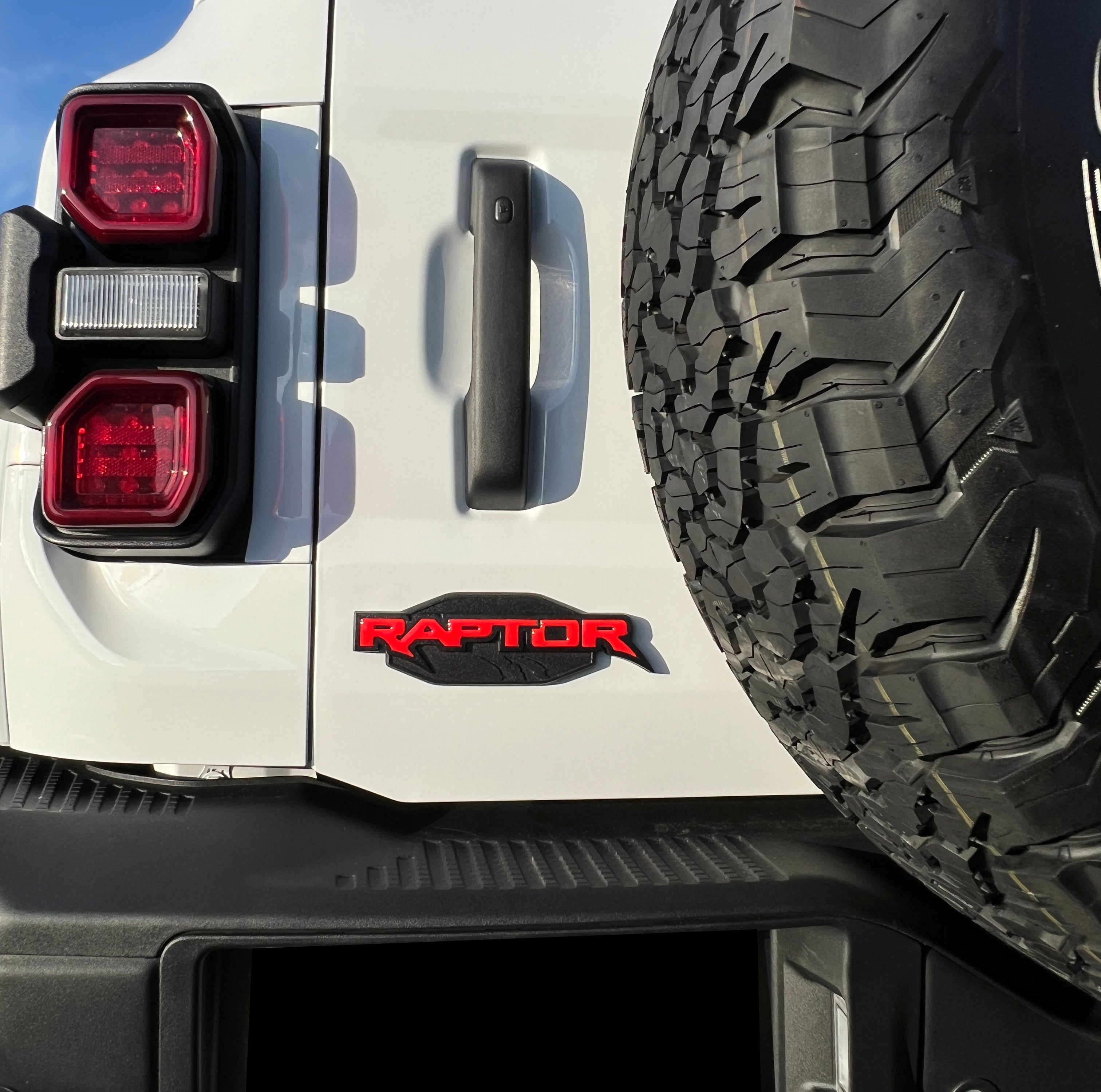 tuf-BRO067-CBO-G · Tufskinz Raptor Emblem Inserts Fits 2022-2025 Ford Bronco Raptor- Cyber Orange